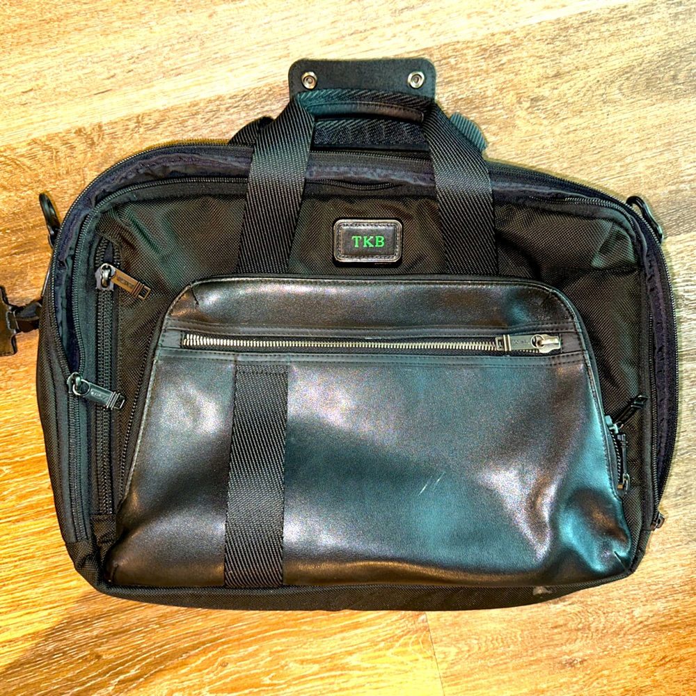 Tumi MOUNTAIN 2/1 briefcase and backpack.